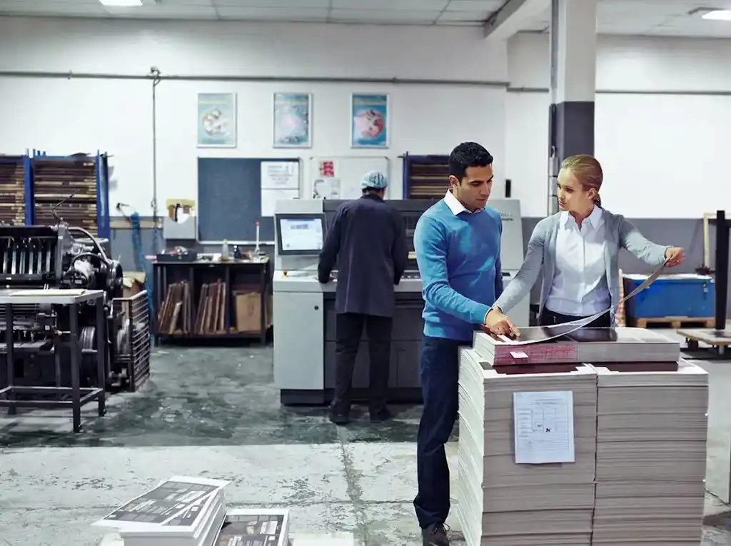 Workers at the Western Press Wholesale Printing Factory in Sydney with offset and digital print Machines